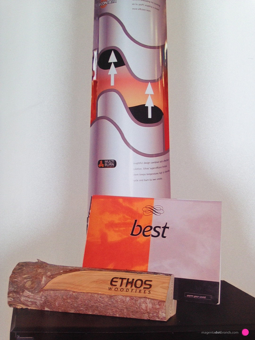 Ethos Woodfires ‘warm your world’ point of sale retail display collateral. A custom cut log laser etched with the Ethos brand acts as a display rack for the Ethos ‘best’ product catalogues on the shop floor.