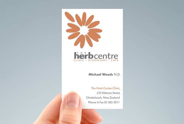 hand-held portrait of Herb Centre Clinic / Dispensary / Café business card, two-sided design, two colour, orange and grey, type and symbol logo, Healthcare, Brand and identity systems design, Illustration
