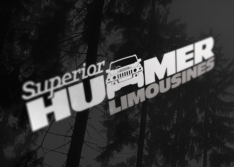 Superior Hummer Limousines logo, detail view of decal on gloss black vehicle paintwork, Brand and identity systems design, Promotional design and advertising, signage