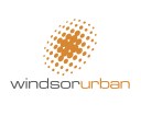 Windsor Urban symbol and type logo and trademark, two colours bright orange and dark grey on white. The symbol is a stylized pool of light drawn in coarse halftone dots that form a radial glow from the centre out within an implied slanted oval shape. Windsor Urban name is set as a unit, in clean extended sans-serif Eurostile font, the words differentiated by a colour change from dark grey to orange. Company rename and rebrand. Brands for New Zealand companies, Christchurch New Zealand.