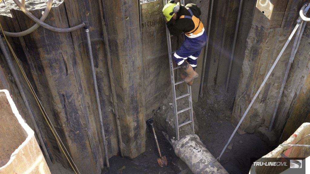 Entering the 5m entry pit, Horizontal Directional Drilling, Tru-Line Civil, documentary photography, Parklands West, Christchurch, New Zealand, Gravity Wastewater Replacement, HDD