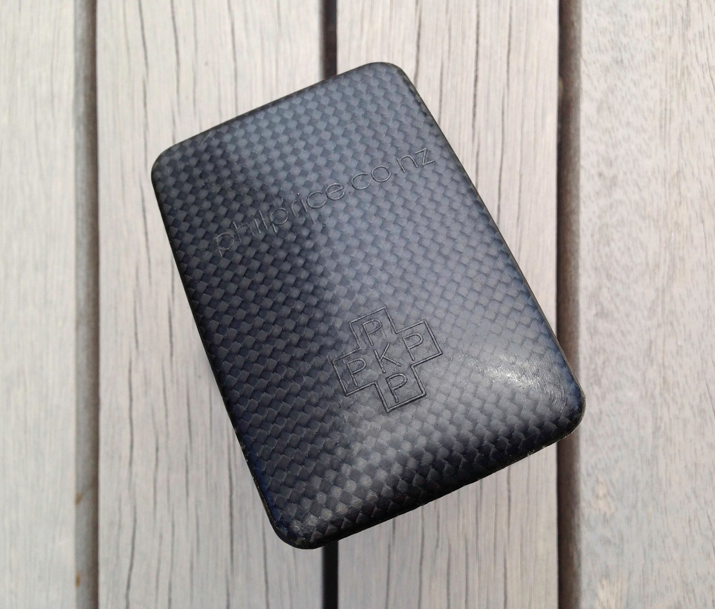 A pocket-size showcase brochure in a custom carbon fibre clam for the kinetic sculptures of Phil Price