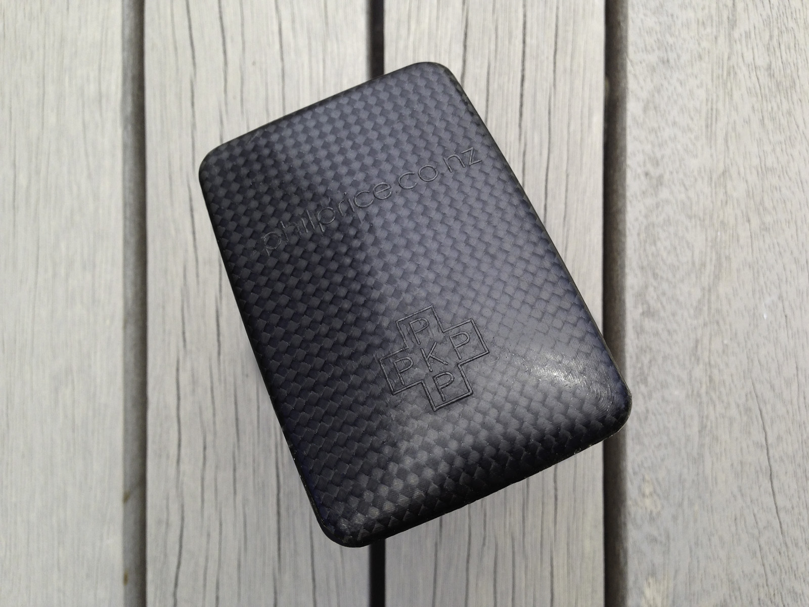 A pocket-size showcase brochure in a custom carbon fibre clam for the kinetic sculptures of Phil Price