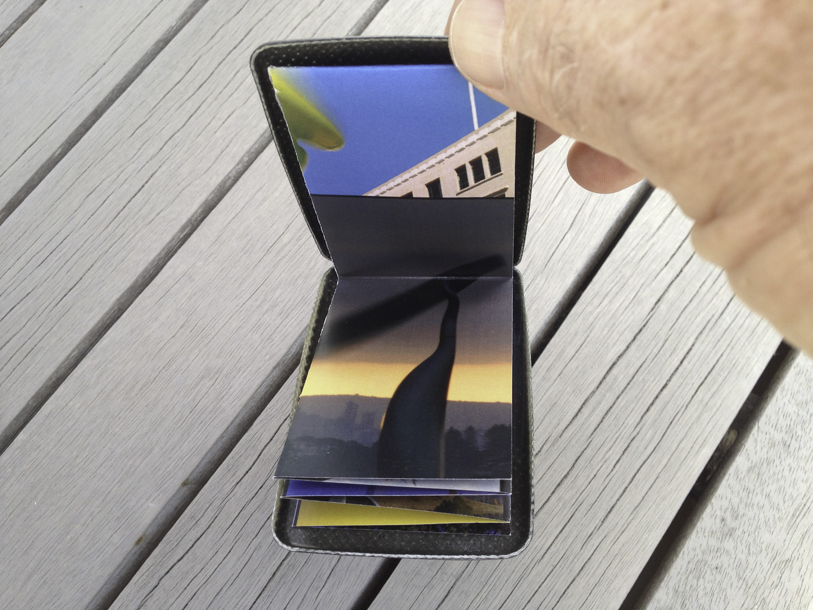 A pocket-size showcase brochure in a custom carbon fibre clam for the kinetic sculptures of Phil Price