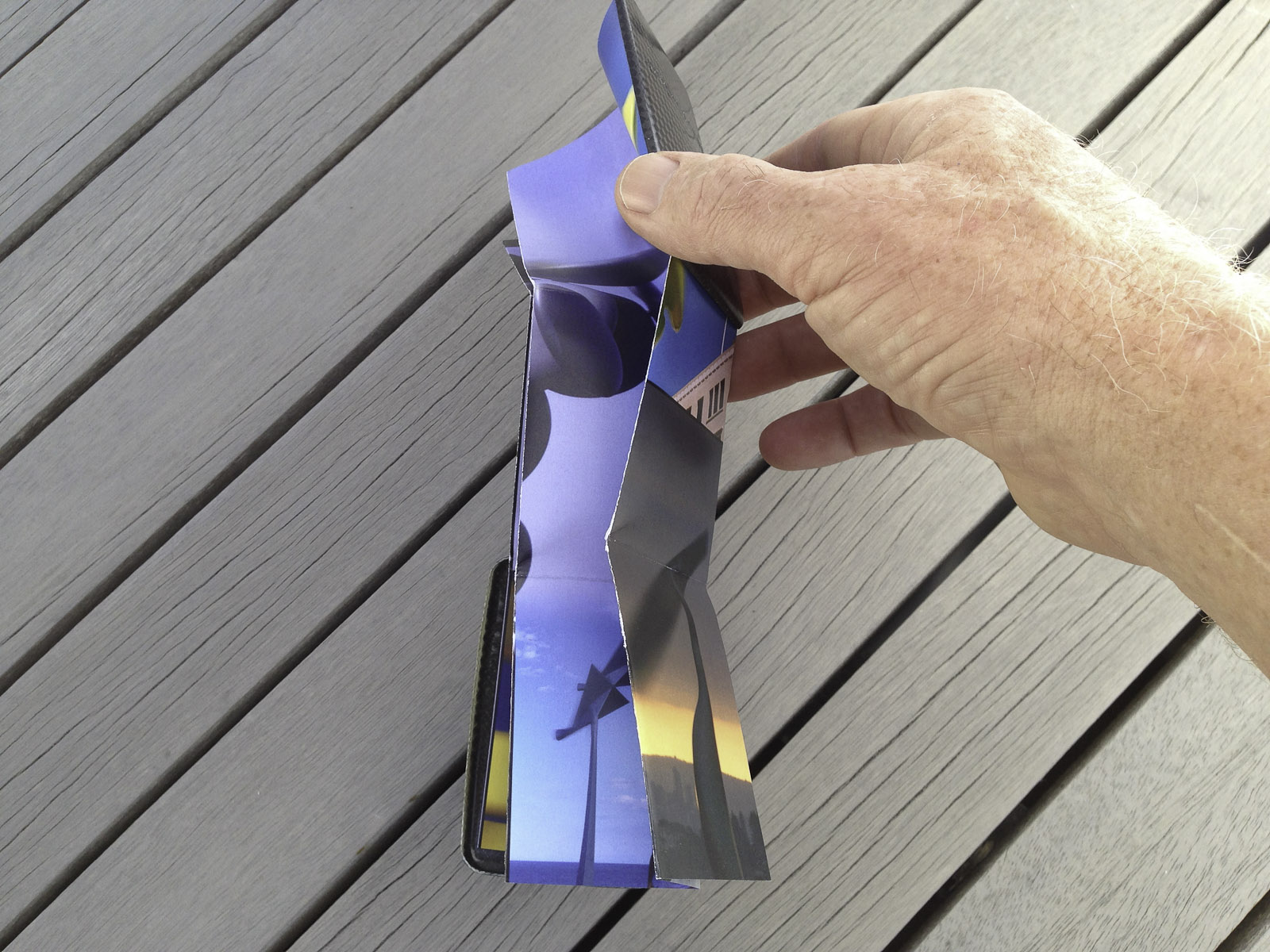 A pocket-size showcase brochure in a custom carbon fibre clam for the kinetic sculptures of Phil Price