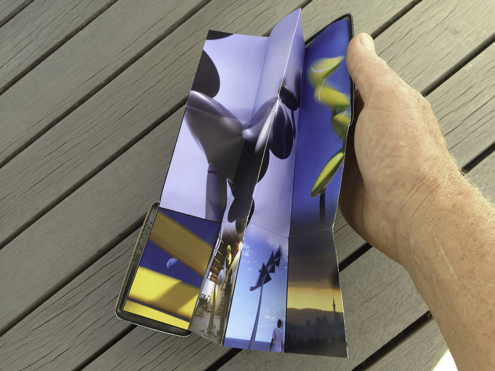 A pocket-size showcase brochure in a custom carbon fibre clam for the kinetic sculptures of Phil Price
