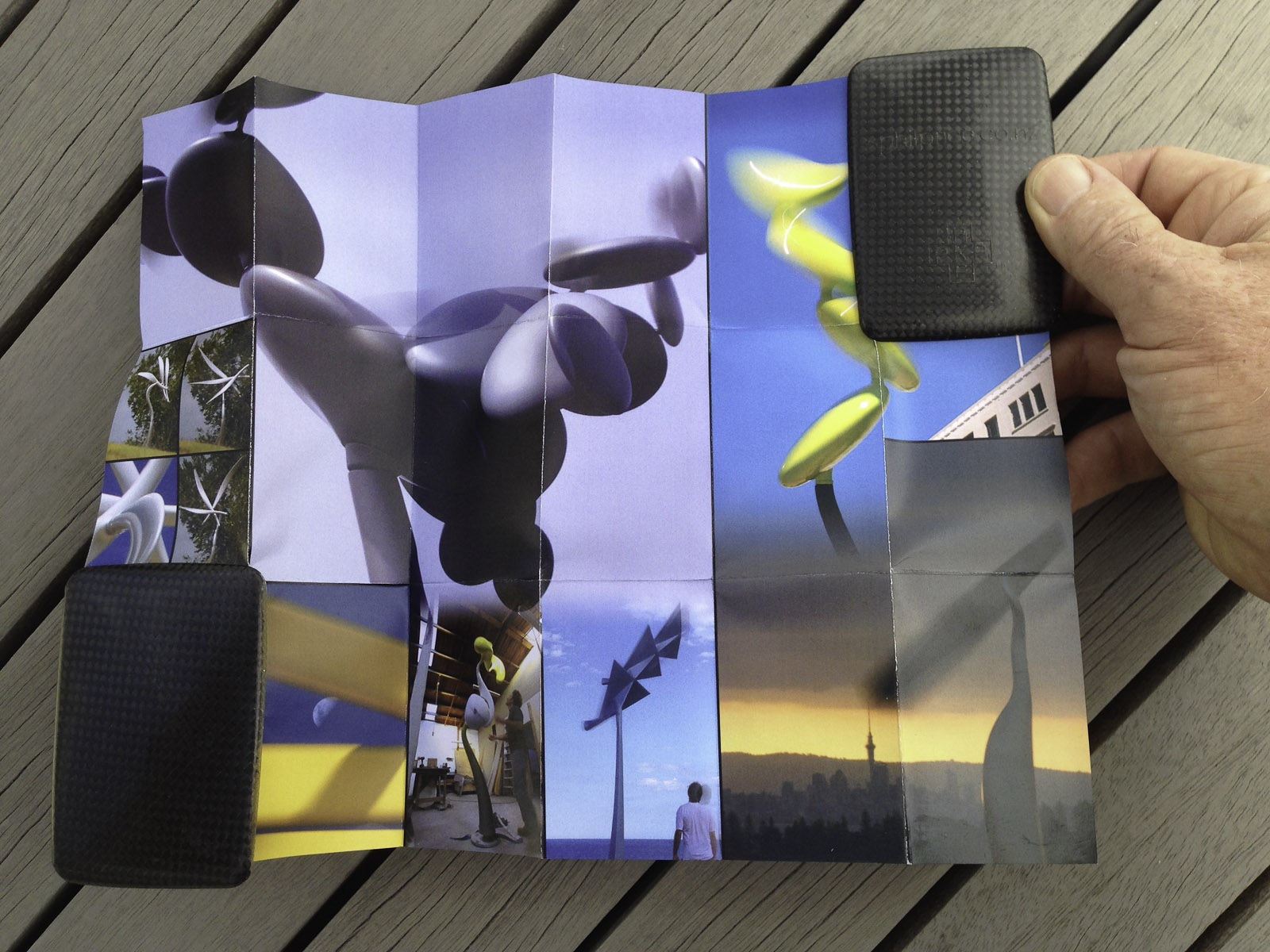A pocket-size showcase brochure in a custom carbon fibre clam for the kinetic sculptures of Phil Price