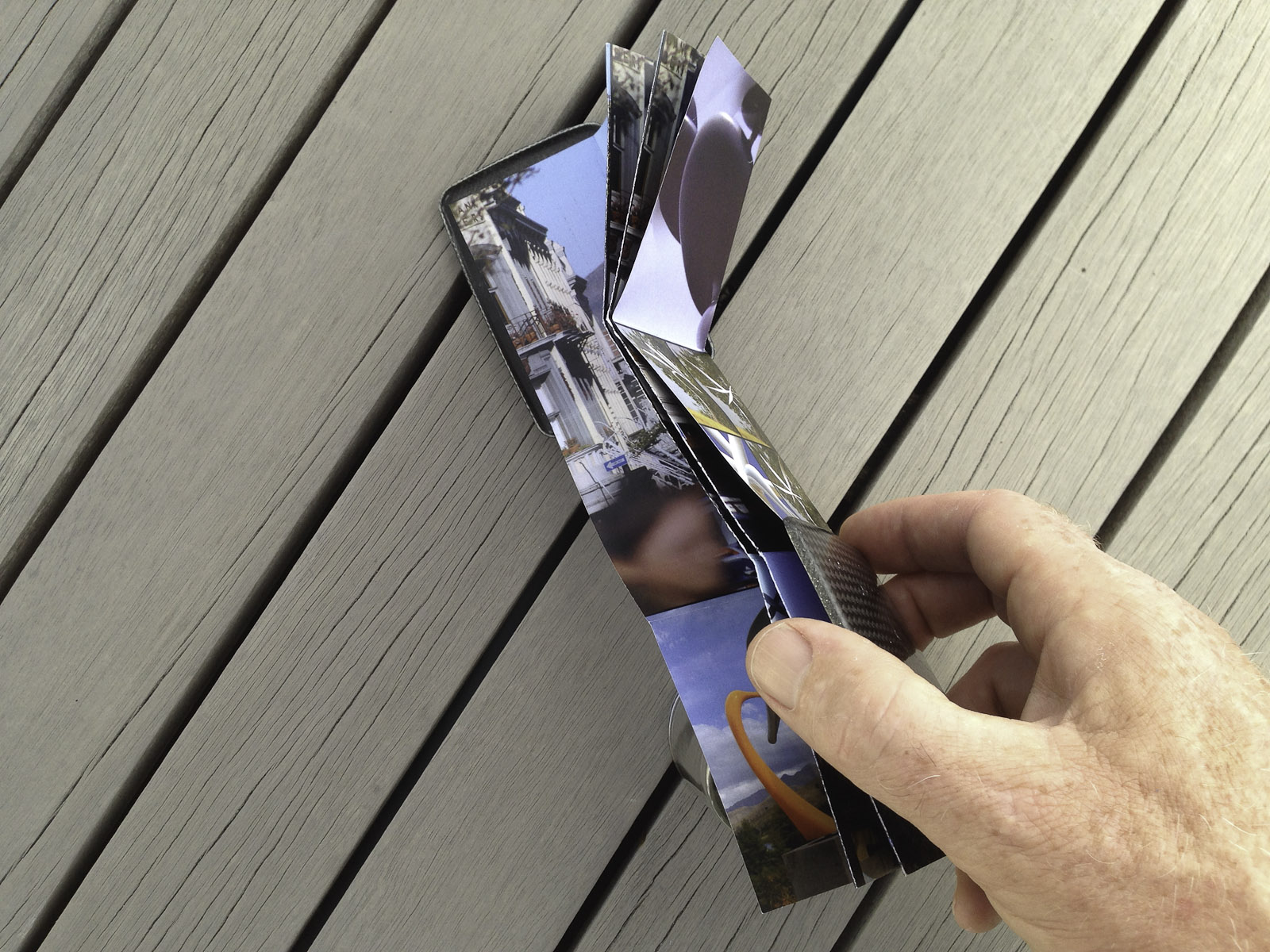 A pocket-size showcase brochure in a custom carbon fibre clam for the kinetic sculptures of Phil Price