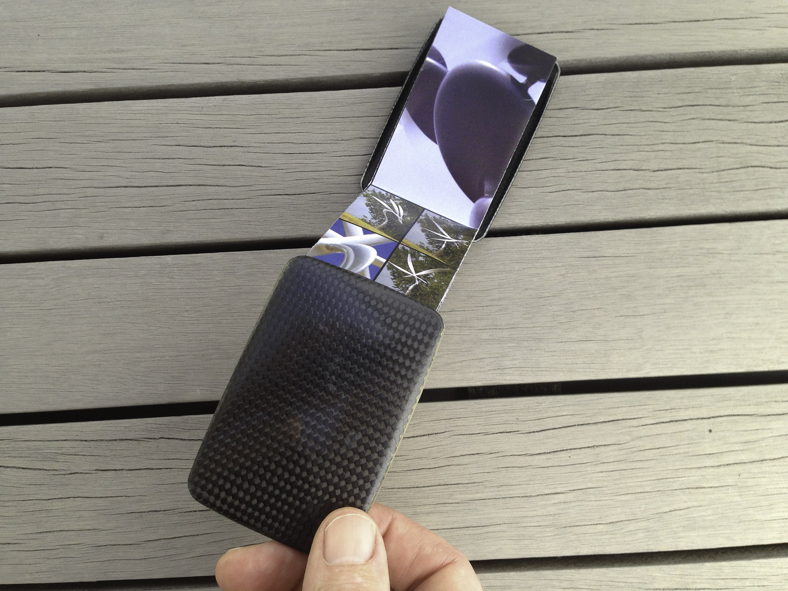 A pocket-size showcase brochure in a custom carbon fibre clam for the kinetic sculptures of Phil Price