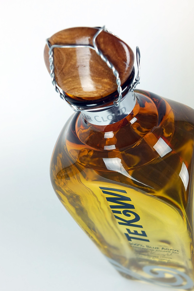 Silver cloud packaging neck label detail.