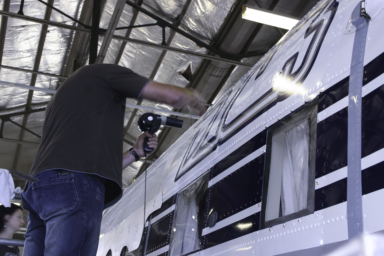 Southern DC3 ZK-AMY livery application, in the Hangar at Wigram