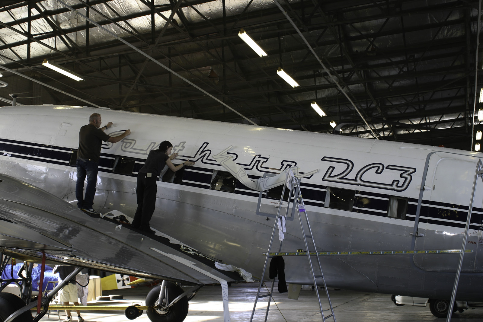 Southern DC3 ZK-AMY livery application, in the Hangar at Wigram