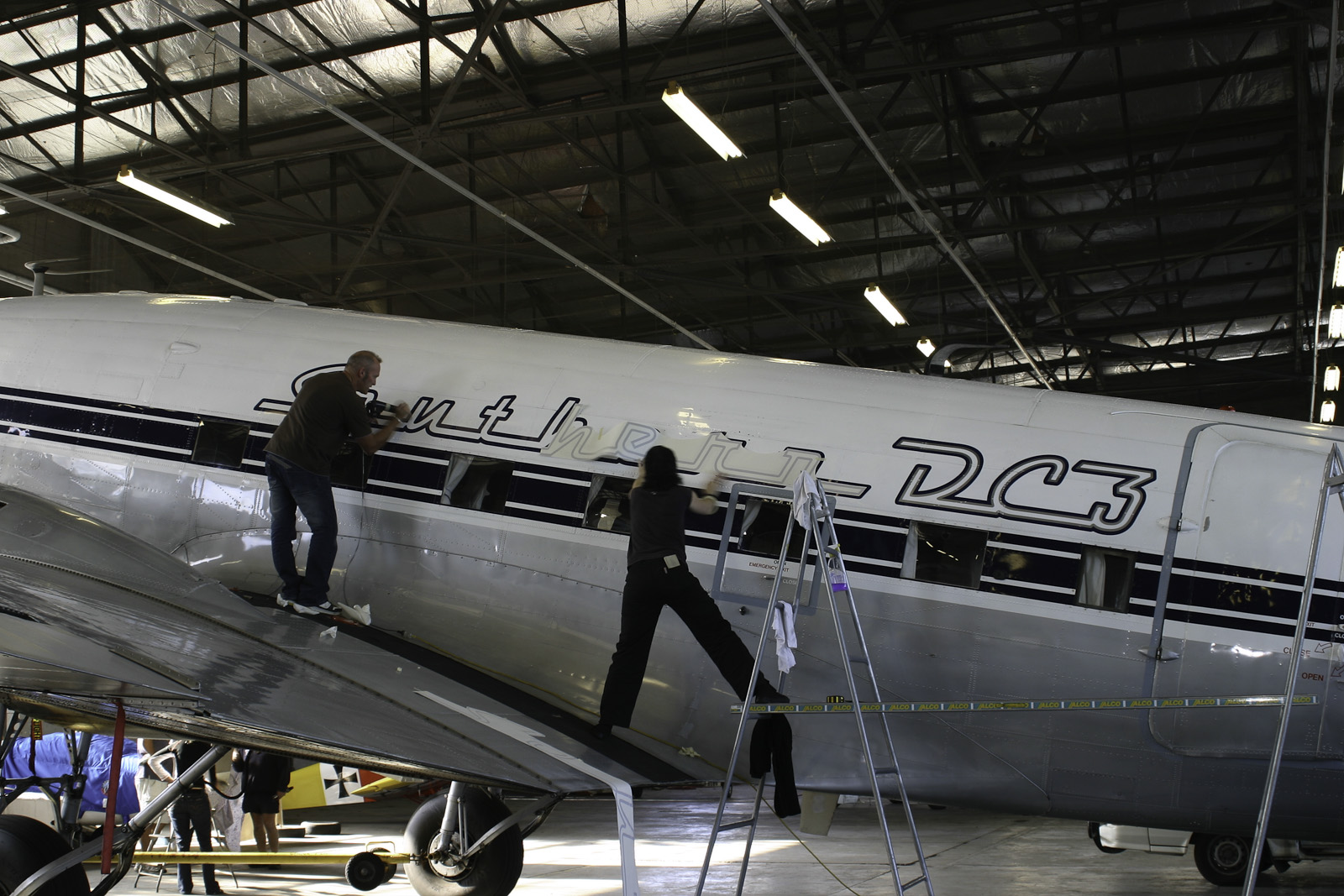 Southern DC3 ZK-AMY livery application, in the Hangar at Wigram, Chistchurch, New Zealand.