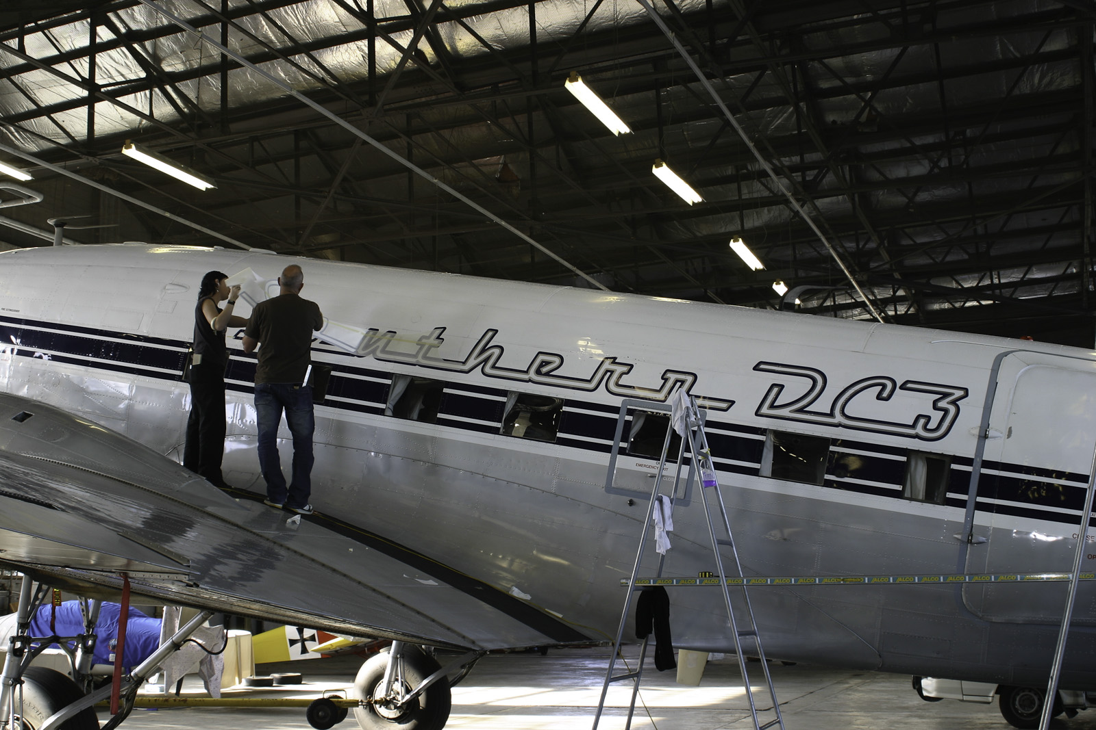 Southern DC3 ZK-AMY livery application, in the Hangar at Wigram, Chistchurch, New Zealand.