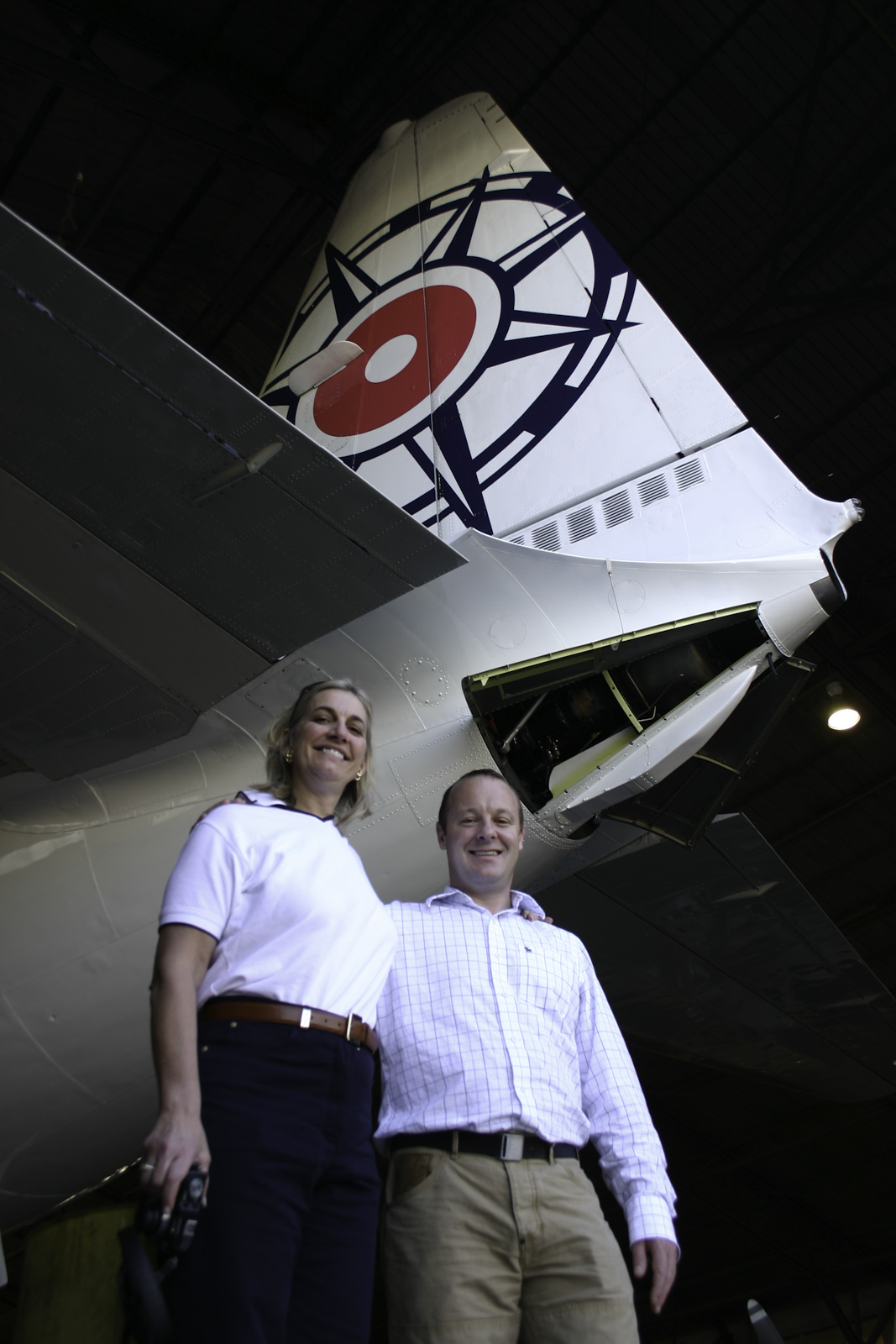 Tim Scott and Robin Tauck beneath the vertical stabiliser of Pionair Australia’s Convair VH-PDV.
