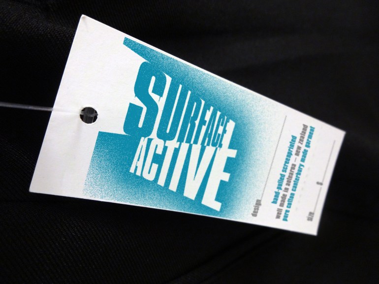 Surface Active T-shirt swingtag front.