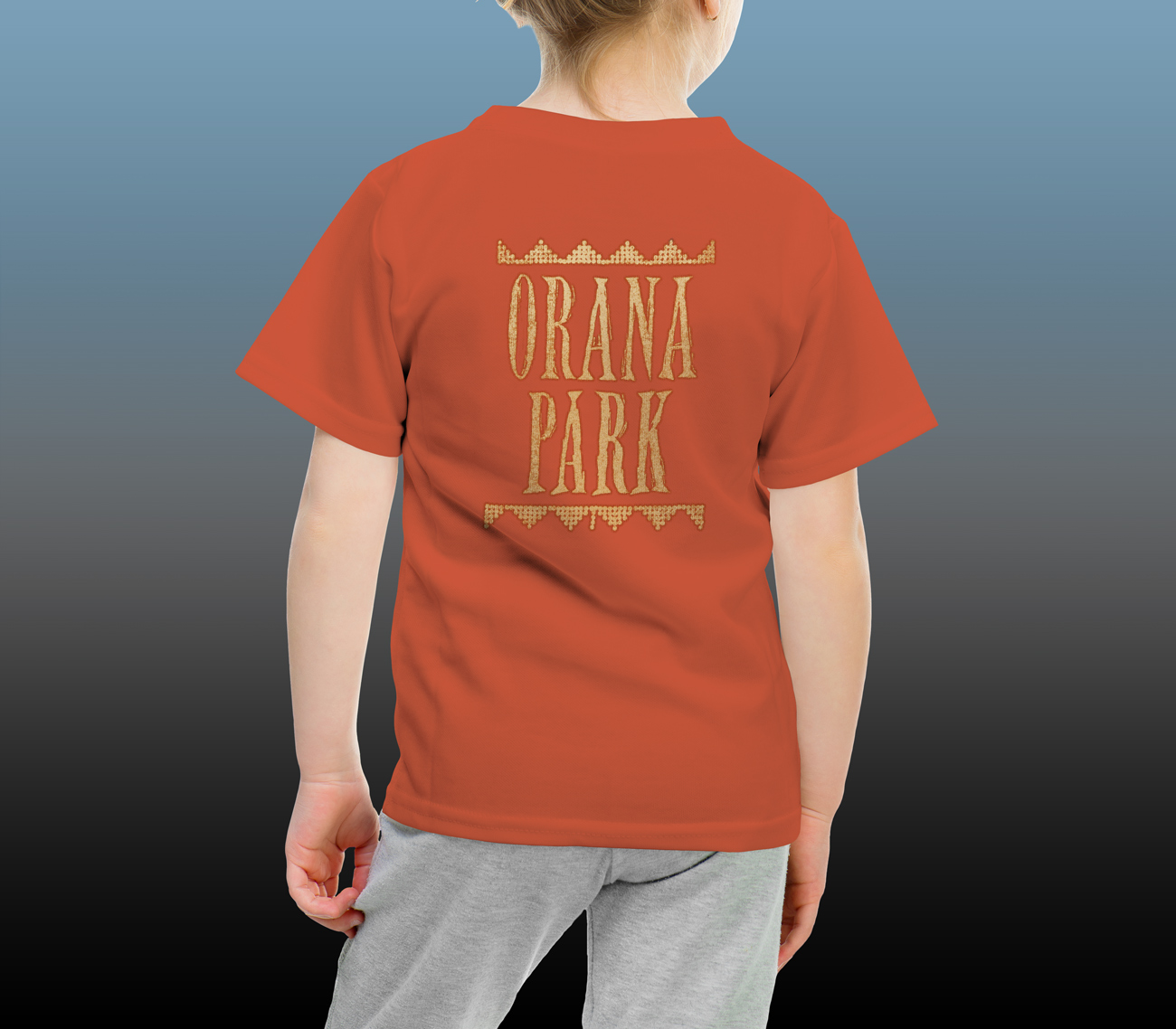 Orana Park kids’ Cheetah screen print on the back of a burnt orange T-shirt