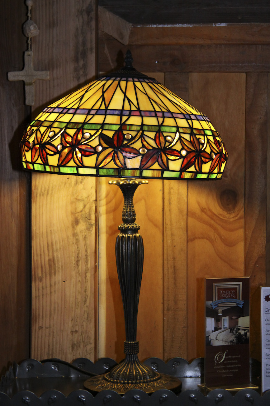 Pomeroy’s Old Brewery Inn English style pub interior details. Art Deco lamp and wood panelling.