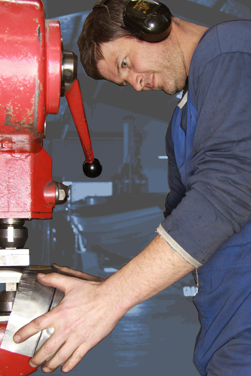Aaron Dunlop forming a custom panel on the English wheel, Panel Shop, Auto Restorations.
