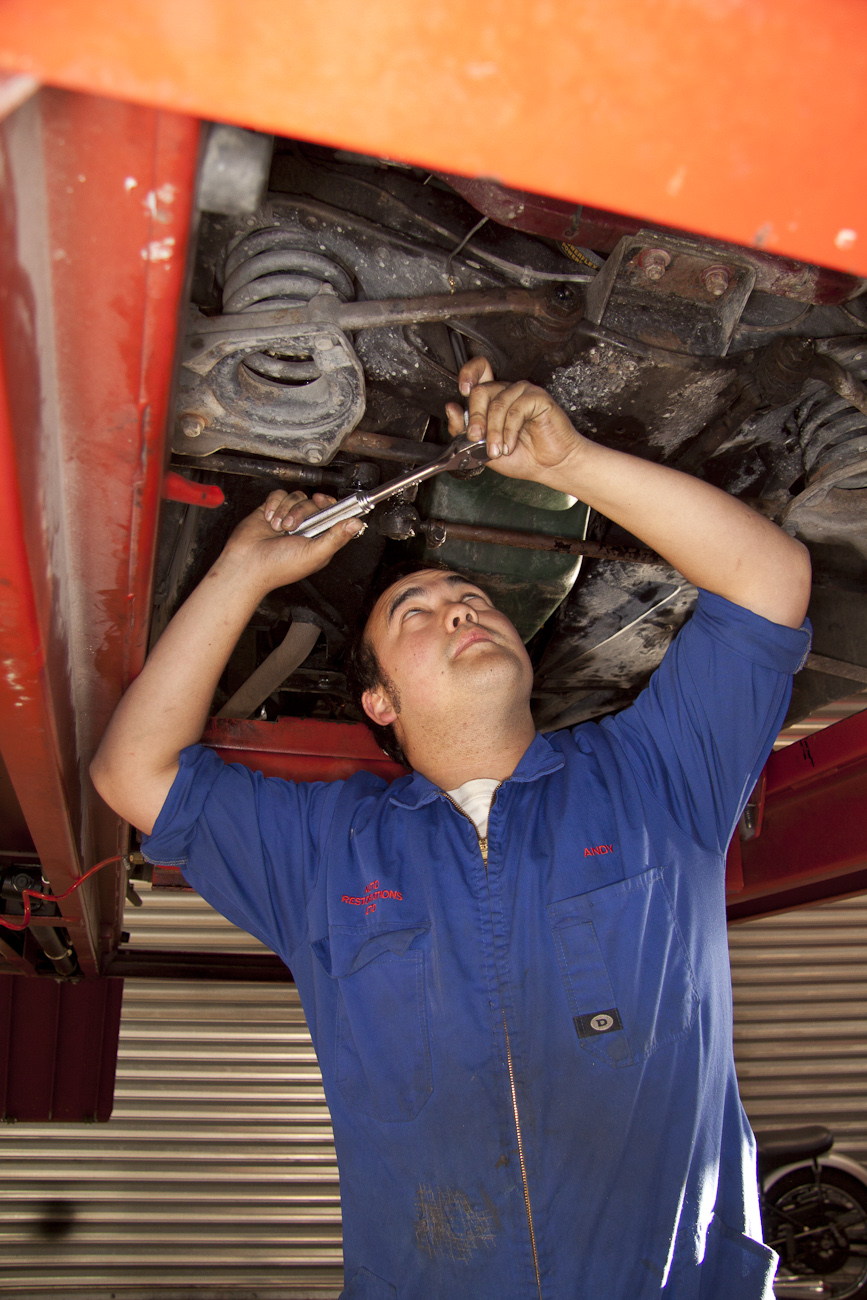 Andy Dalton, works under the hoist in the Mechanical Shop.