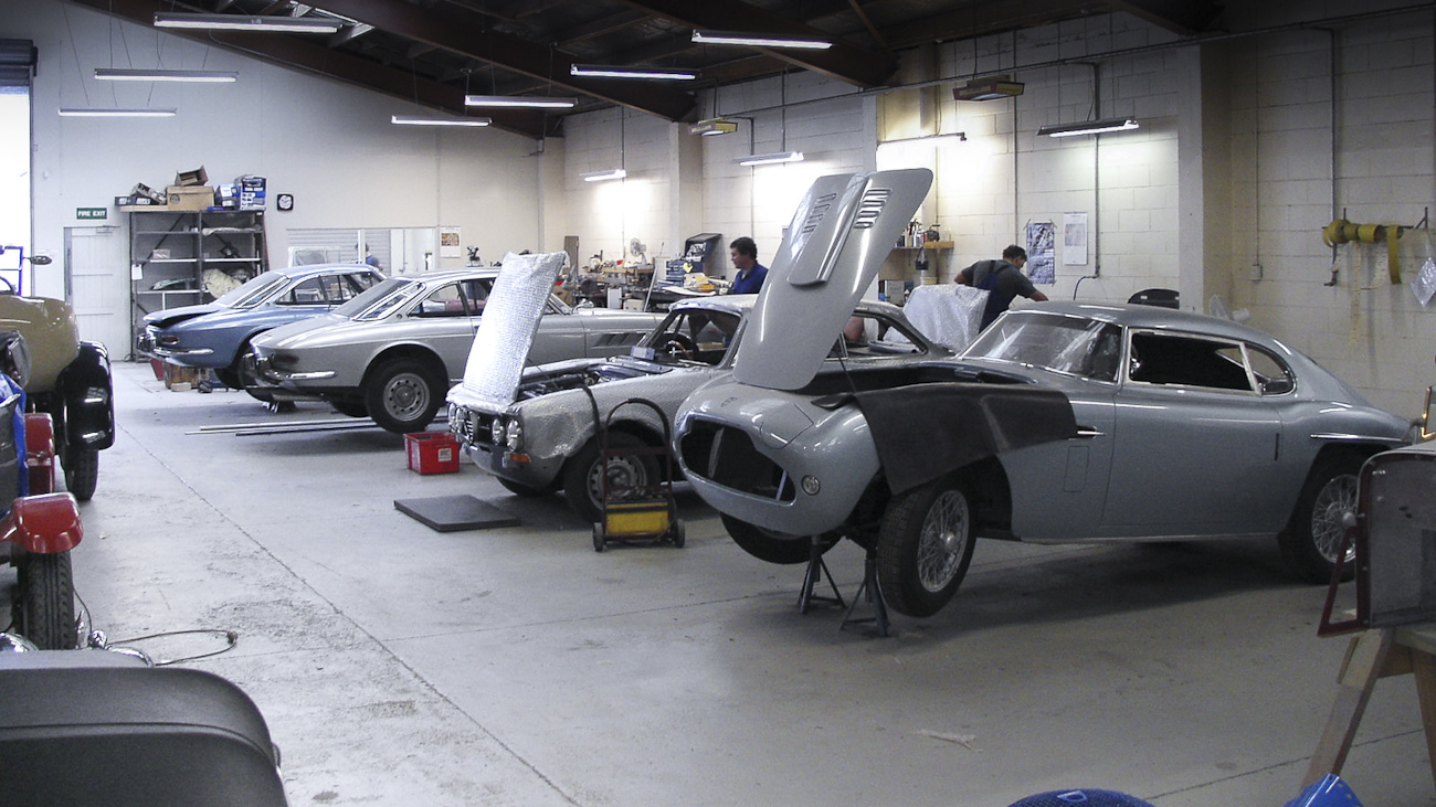 Line up of in-progress restorations of rare mid-century classics in the Panel Shop and at Auto Restorations. From front to back a Siata 280CS Balbo, an Alfa Romeo and a pair of Ferrari.