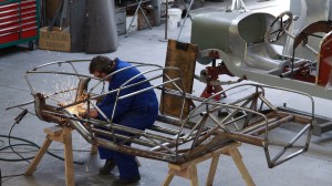 Andy Wylie hand finishing the welding on the bespoke space frame of a 1953 Barchetta recreation “kit” car, in the Custom Coachwork Shop at Auto Restorations.