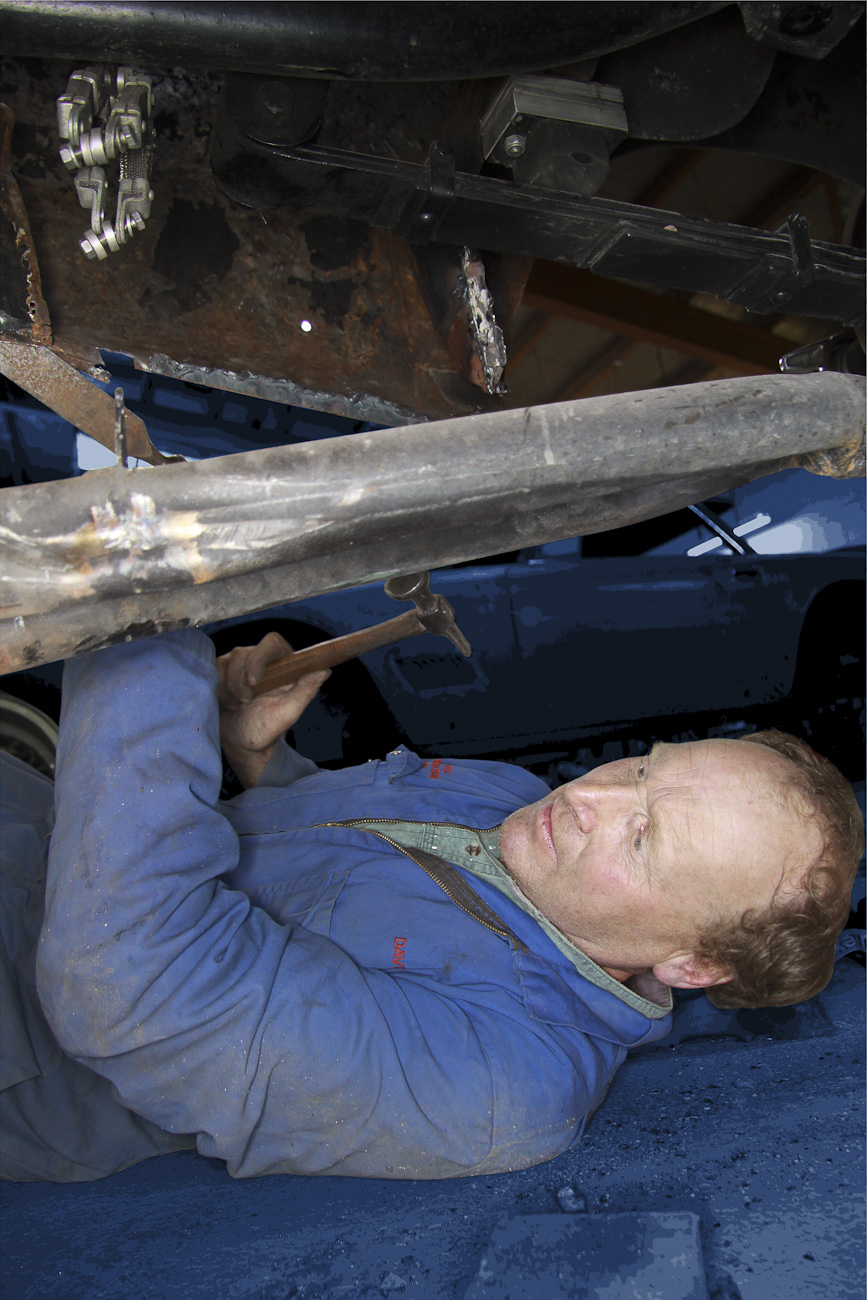 Des Ward disassembling panels on a classic Maserati restoration in the Panel Shop at Auto Restorations.