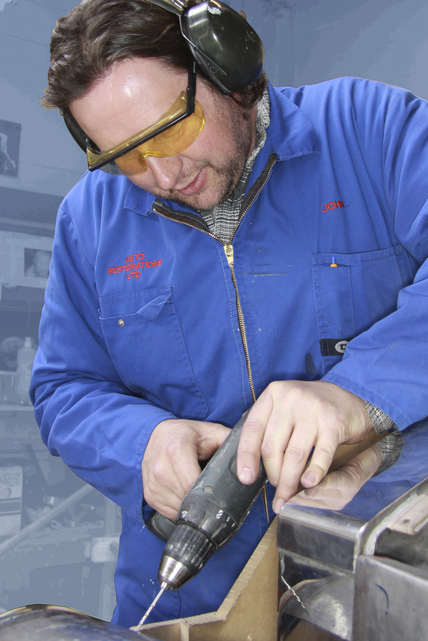 John Scott, working on the front guard of a classic Rolls Royce restoration, Panel Shop, Auto Restorations.