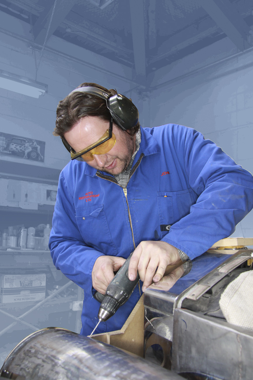 John Scott, working on the front guard of a classic Rolls Royce restoration, Panel Shop, Auto Restorations.