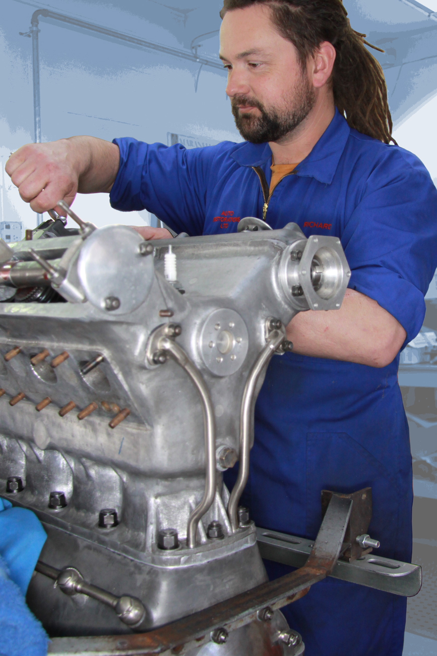 Richard Hope at work on rebuilding a classic V8 engine in the Mechanical Shop at Auto Restorations.