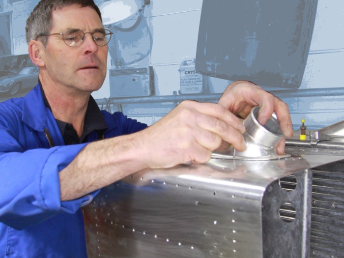 Robin Willan fabricating a bespoke radiator for a WWII warbird aircraft restoration. Radiator Shop, Auto Restorations.