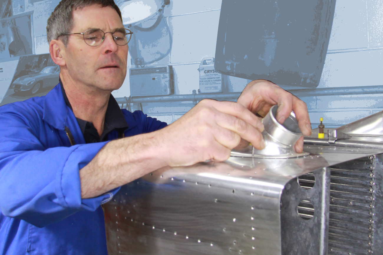 Robin Willan fabricating a bespoke radiator for a WWII warbird aircraft restoration. Radiator Shop, Auto Restorations.