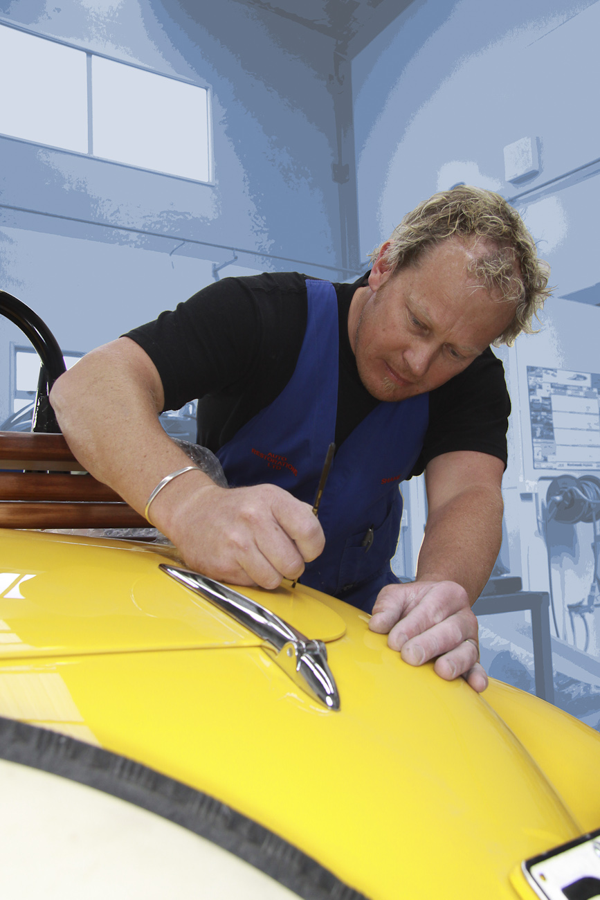 Shane Faulkner putting the finishing touches on the paint job of a complete Delage restoration, Paint Shop, Auto Restorations.