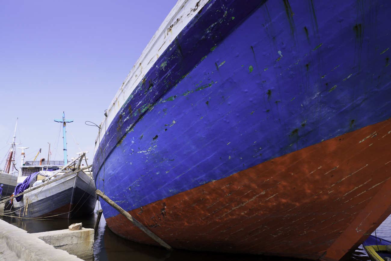 Lambo or lamba type of motorised Pinisi line up at Sunda Kelapa, old harbour Jakarta. Pinisi are a traditional Indonesian two to three-masted sailing ship akin to a cutter.