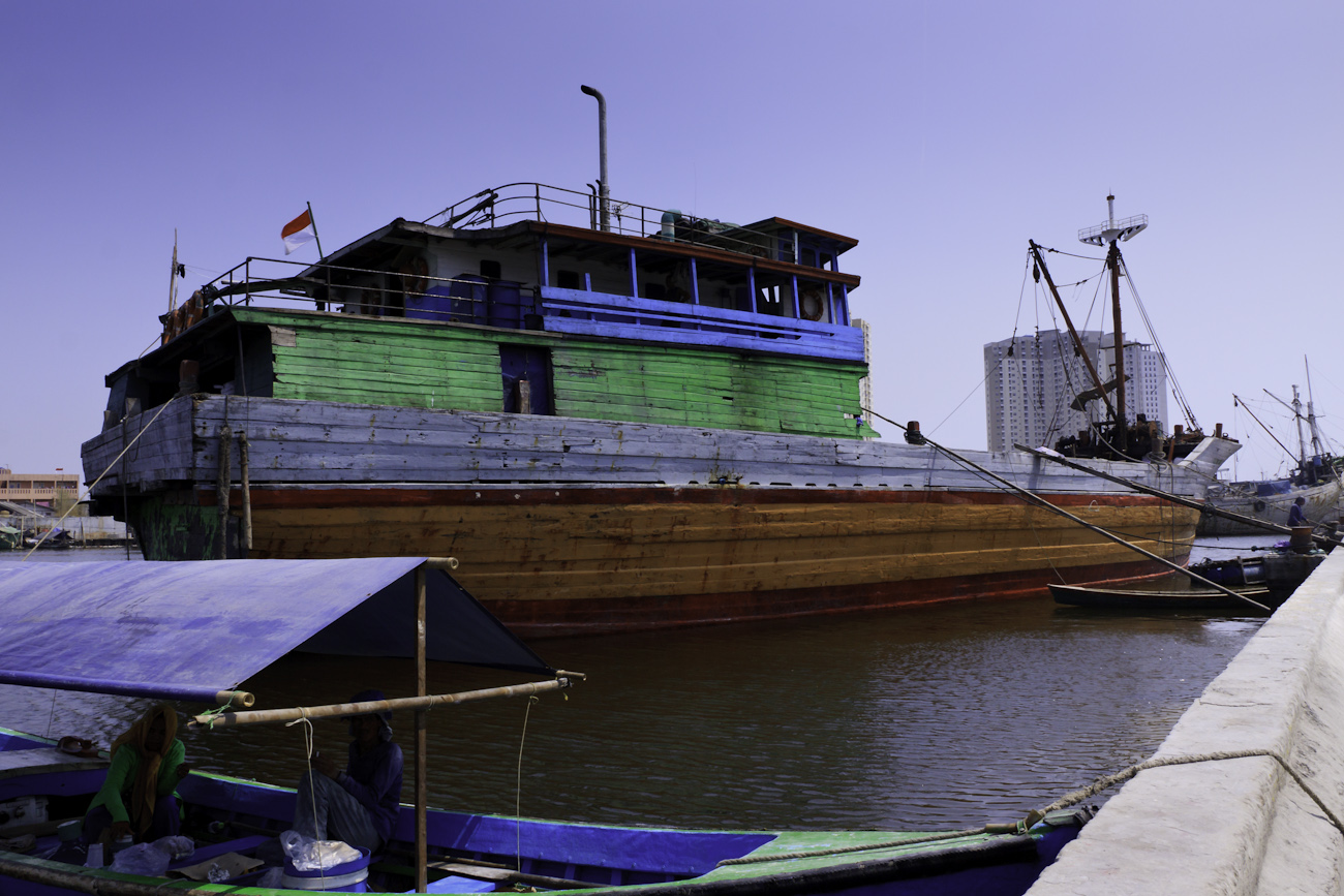 Lambo or lamba type of Pinisi line up at Sunda Kelapa, old harbour of Batavia, now Jakarta. Pinisi are a traditional Indonesian two to three-masted sailing ship akin to a cutter.