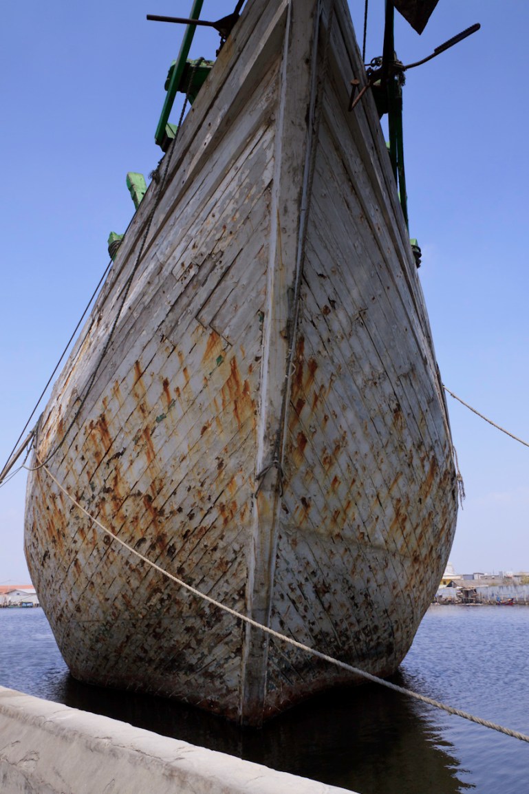 The prow of Bintang Harapan Jaya a magnificent Makassar schooner called Pinisi. Seen on a tour of the Port of Sunda Kelapa, Jakarta, Indonesia.
