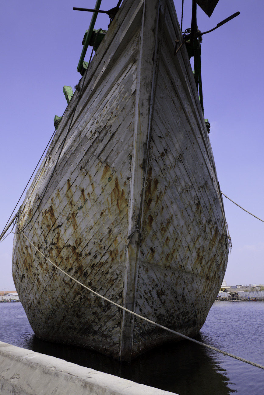 The prow of Bintang Harapan Jaya a magnificent Makassar schooner called Pinisi. Seen on a tour of the Port of Sunda Kelapa, Jakarta, Indonesia.