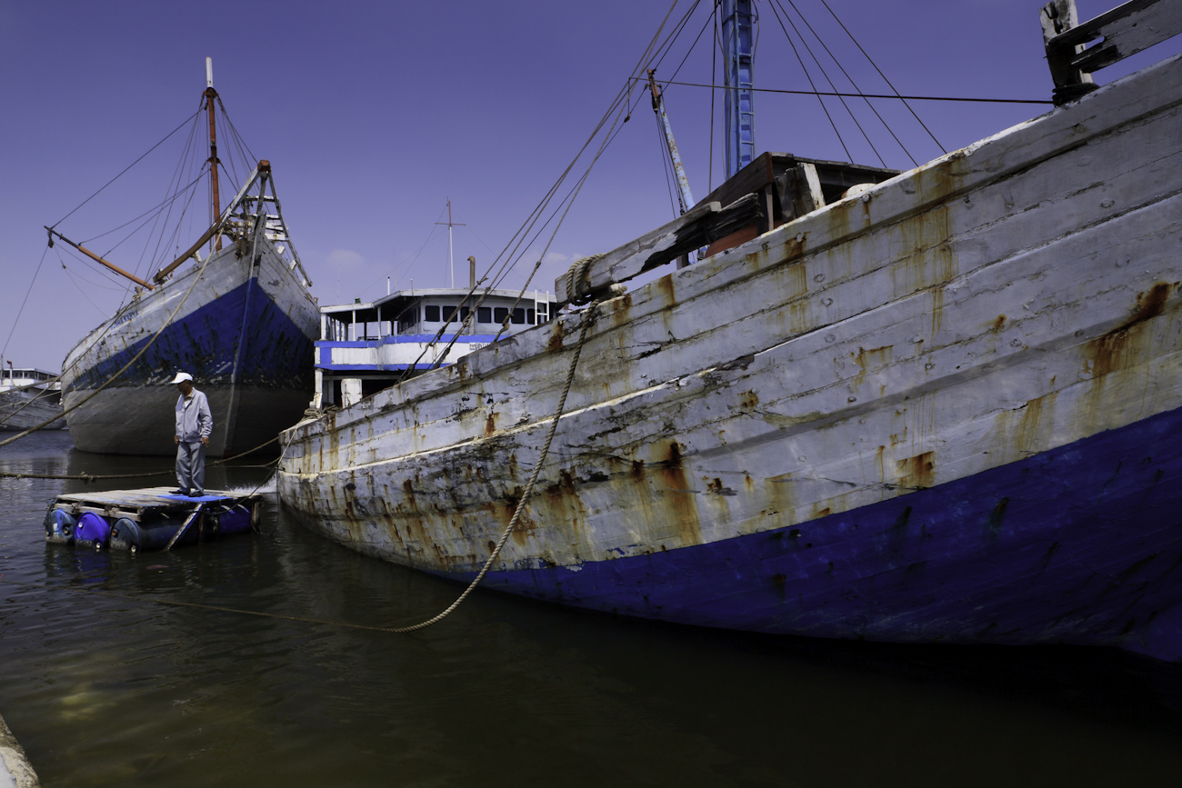 Lambo or lamba type of motorised Pinisi line up at Sunda Kelapa, old harbour of Jakarta. Pinisi are a traditional Indonesian two to three-masted sailing ship akin to a cutter.