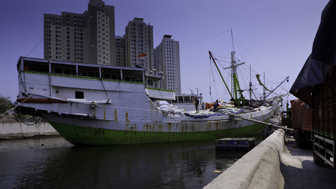 Lambo or lamba type of motorised Pinisi line up at Sunda Kelapa, old harbour of Jakarta. Pinisi are a traditional Indonesian two to three-masted sailing ship akin to a cutter.