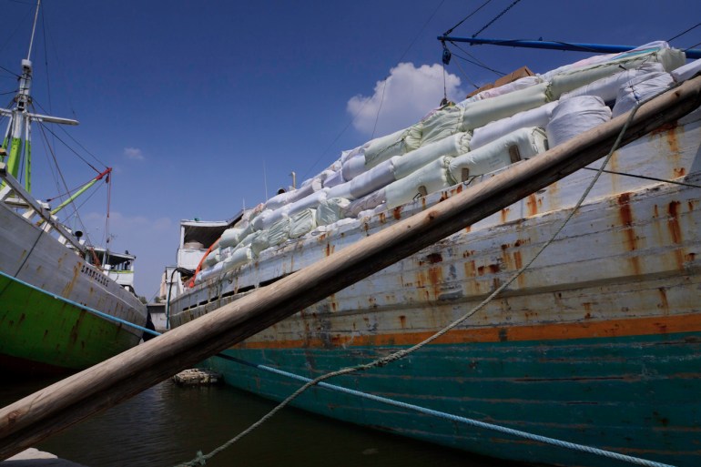 A lamba type of motorised Pinisi named Citra Bahagia laden with cargo at the old port of Sunda Kelapa, Jakarta, Indonesia.