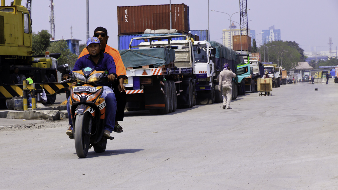 Two coolies ride down the old wharf of the Sunda Kelapa old port.