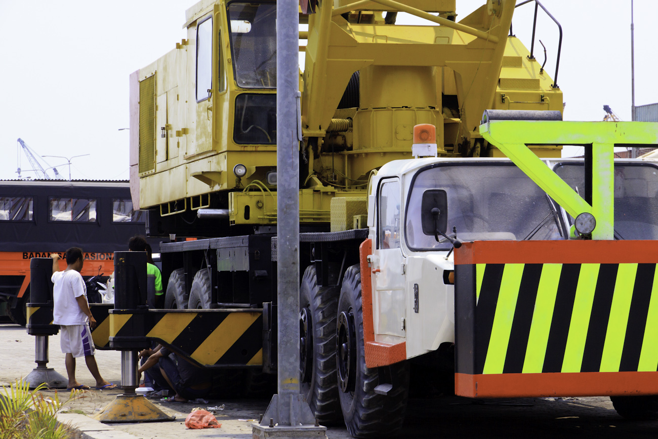 Large mobile crane on the wharf of the old port of Sunda Kelapa, Jakarta, Indonesia.