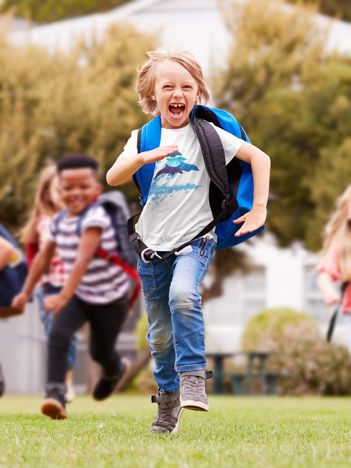 A dolphins leaping New Zealand t-shirt on a cheerful boy running.