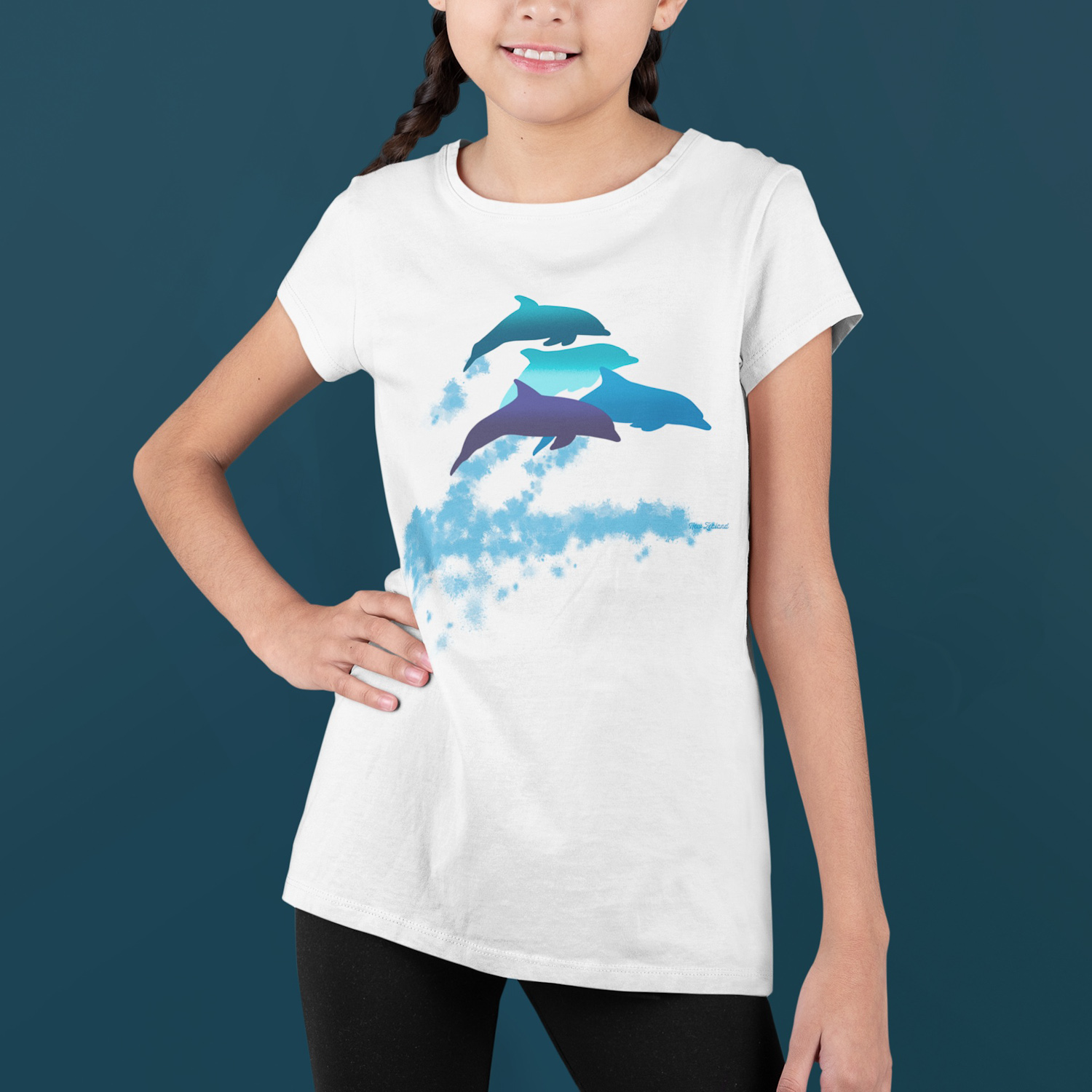 A smiling girl with two braids in a dolphins leaping New Zealand t-shirt.