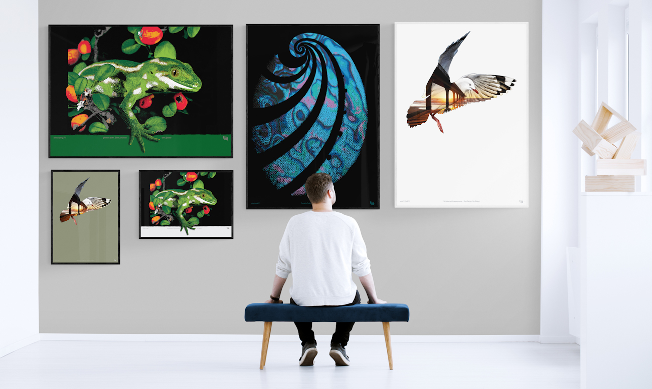 Five Surface Active art prints on a sunlit gallery wall.