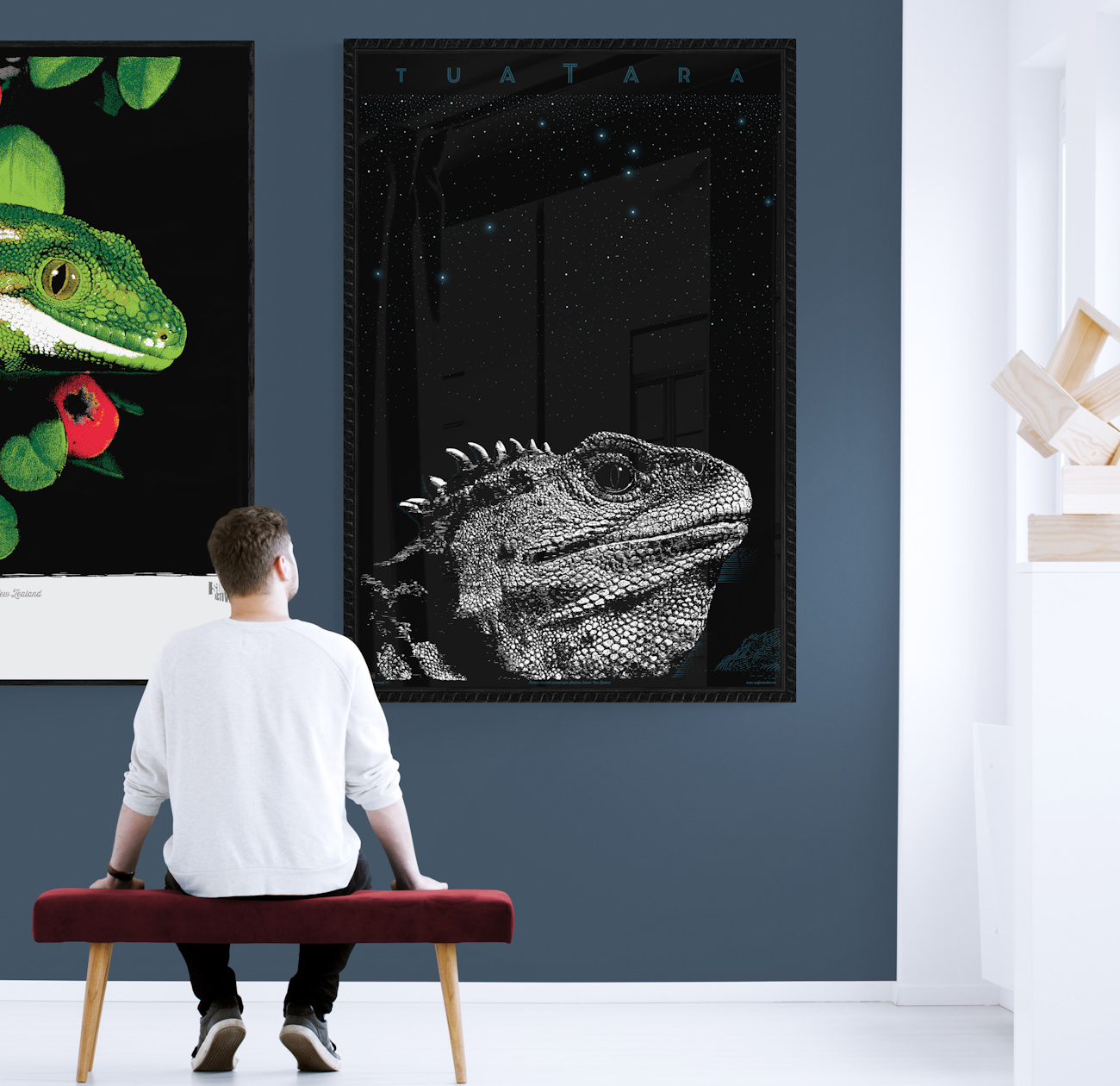 Two Surface Active art prints, the Jewelled gecko and Tuatara portrait hung on a gallery wall.