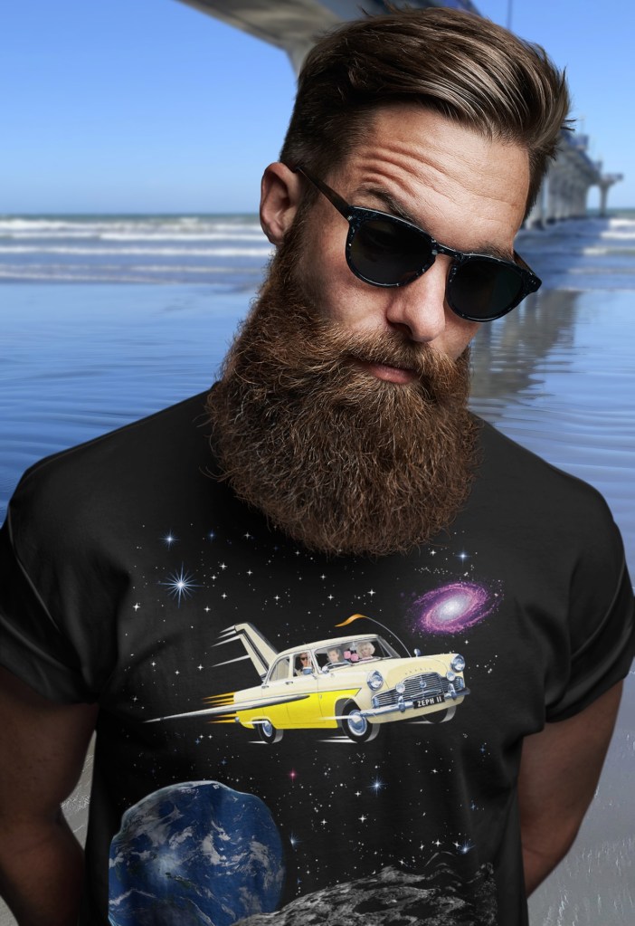 A black Surface Active t-shirt with illustration of a 1961 Ford MkII Zephyr re-imagined as NASA’s space shuttle being worn by a man in sunglasses at New Brighton beach, beside the Pier.