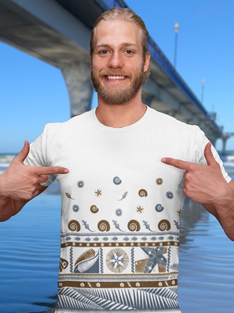 A man showing his white Surface Active tapa all-over printed t-shirt.
