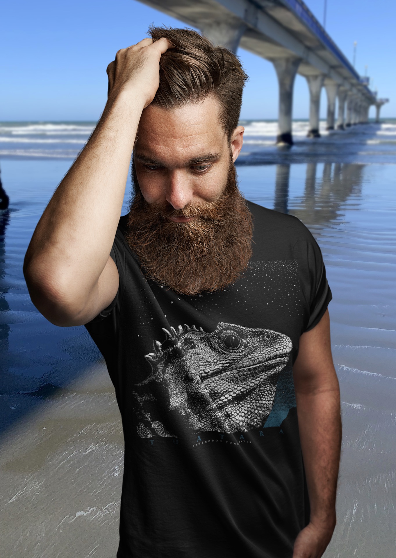 Black and white image of a Surface Active tuatara portrait printed on a black t-shirt, the tuatara is a lizard native to New Zealand.