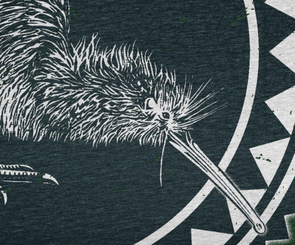 Detailed close-up view of our Surface Active Iconic Kiwi, New Zealand design all-over printed on a forest green t-shirt.